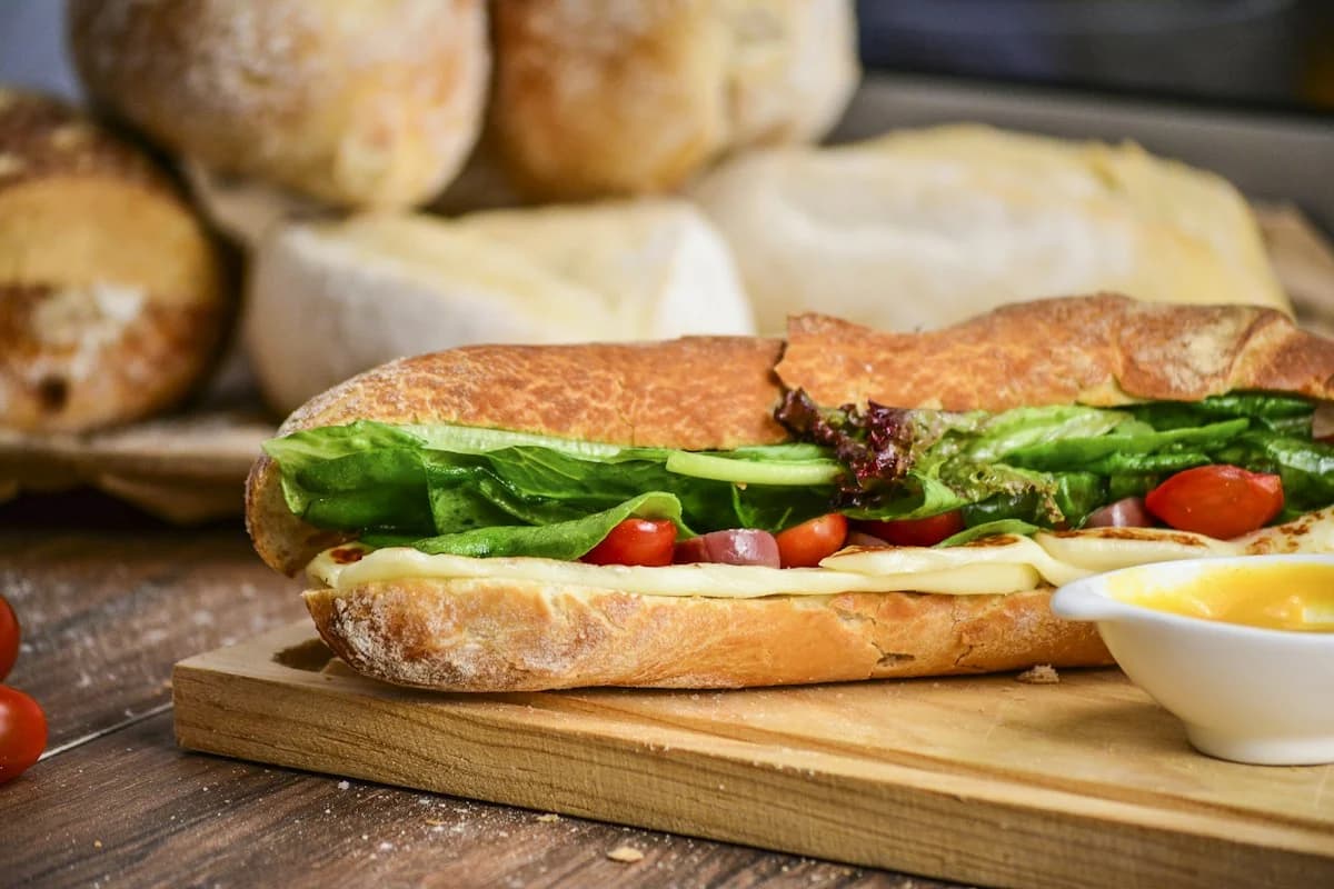 Toasted open sub sandwich with fresh vegetables and seasoned paneer