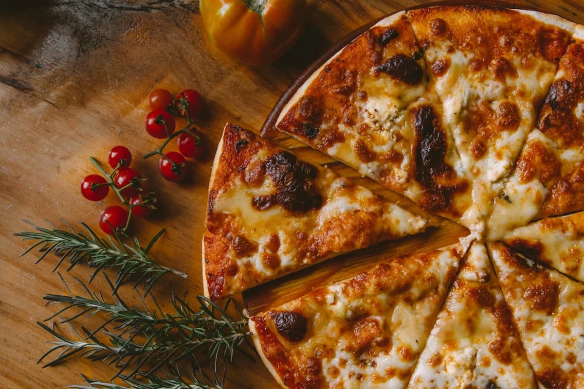 A freshly baked stone-oven vegetarian pizza with mozzarella and basil